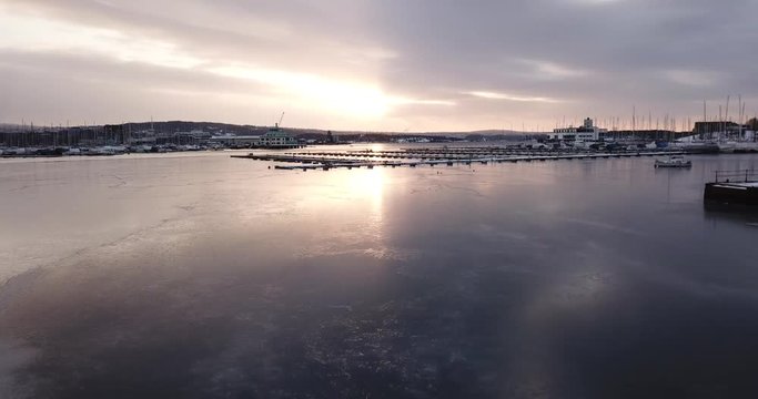 Aerial footage of Frognerkilen Marina and Aker Brygge at sunrise in Oslo, Norway