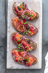 Cured salmon gravlax on a crusty bread
