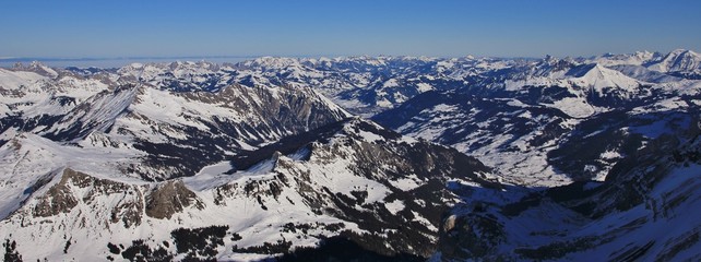 Saanenland valley on a winter morning. view from Glacier des Diablerets, Switzerland.