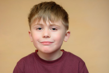 Portrait of a very positive boy on an isolated background