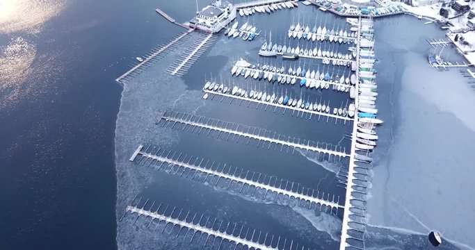 Aerial footage of frozen Frognerkilen Marina in Oslo, Norway in winter 2018