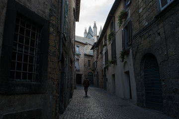 Through the dark, narrow streets of Orvieto Old Town in Umbria, Italy