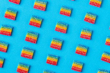 Colorful candies pattern on a blue background.