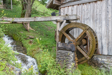 Traditional wooden waterwheel near Werfen in Pongau valley, Austria. The water-wheel was used to generate power for crunching cereals