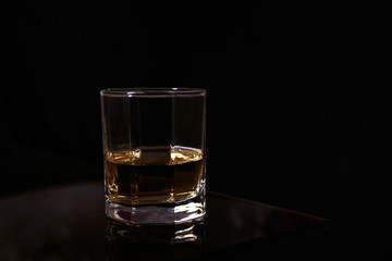  a glass of hot drink on a glass table