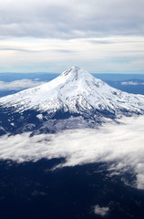 
    Snow-capped mountain peak from the air. 