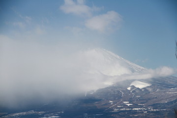 Fototapeta na wymiar Snow mountain covered by clouds in Japan