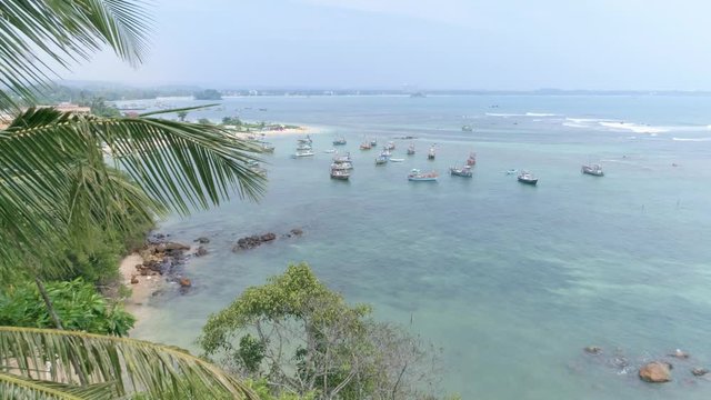 Aerial footage of some fishing boats in the Weligama Bay in Sri Lanka. Slowmotion footage in 4k.