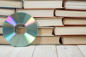 Book with compact disc over white background e book or digital storage concept