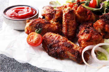 crispy barbecue chicken wings bbq on grey background