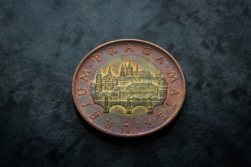 Czech republic currency, Fifty crowns coin reverse with Prague castles and bridge on black gray background