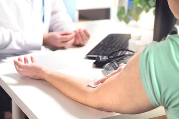 Blood test, sample or donation concept. Doctor with patient in hospital office, emergency room or...