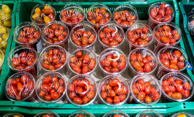 Fototapeta premium Cherry tomatoes in plastic. view from above