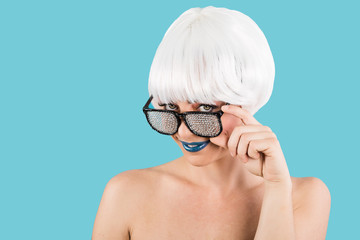 Flirting woman in glasses with gems