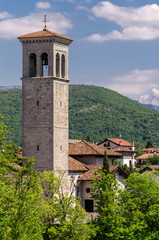 Fototapeta na wymiar view of an old bell tower in Cividale del friuli during summer, Italy.