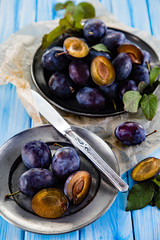 Plums on cutting board