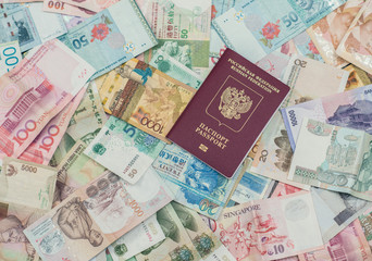 russian passport  on Asia money background . Currency of Hong Kong, Indonesia, Malaysia, China, Thai, Singapore dollar. Travel and business concept 