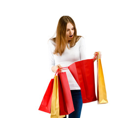 Fototapeta na wymiar Young woman holding shopping bags isolated on white background