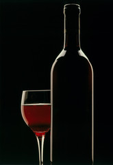 Bottle of wine with glass