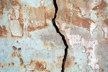 grunge plaster texture with crack and traces of paint