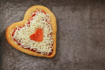 Heart shaped Pizza dough ready to bake/ Valentines day concept
