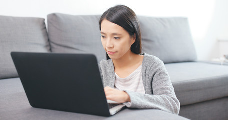 Woman use of laptop computer at home