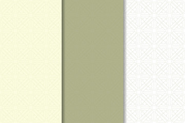 Olive green and white geometric ornaments. Set of seamless patterns