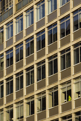 Full frame pattern of windows in a 60's or 70's style office block in London, UK