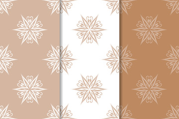 Brown floral backgrounds. Set of seamless patterns