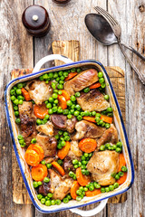 Meat baked with carrot and green peas