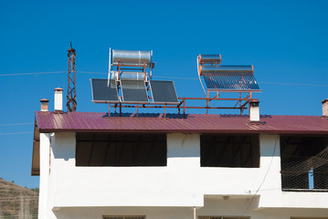 solar set for water heating at roof with solar panels © golicin