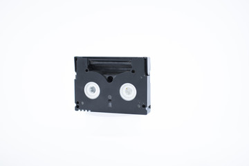 Old video cassette tape on white background.