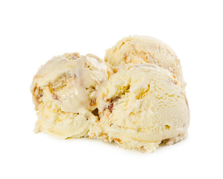 Three balls of vanilla ice cream with caramel