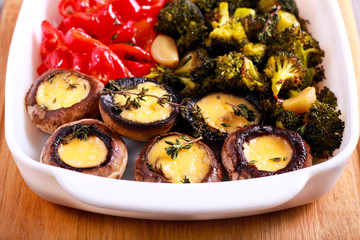 Baked mushrooms with cheese, broccoli