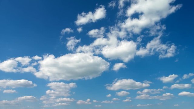 Timelapse background with moving lamb clouds in the blue sky, without birds, 4K