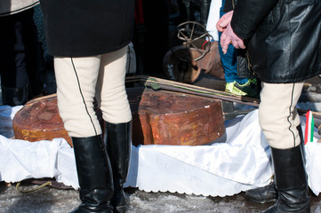 Mens  in traditional clothes, double bass on the background, at  the winter ending Transylvanian...