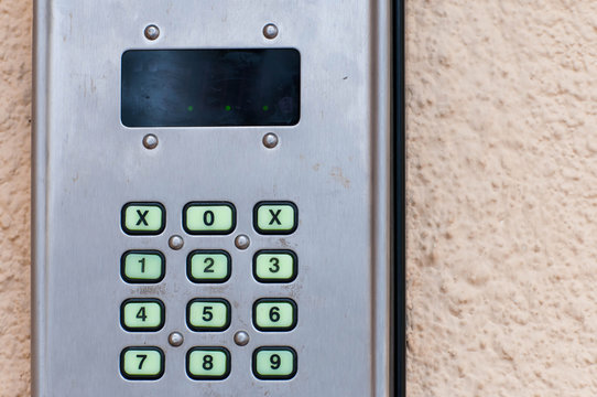 Front door digital card reader close up shot on natural light.
