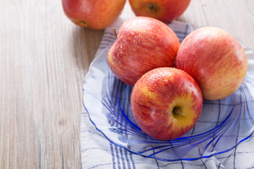 Fresh red apples with water drops