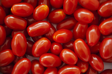 Full frame vibrant red miniature plum tomatos
