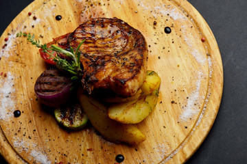 grilled beef steak with potatoes and vegetables