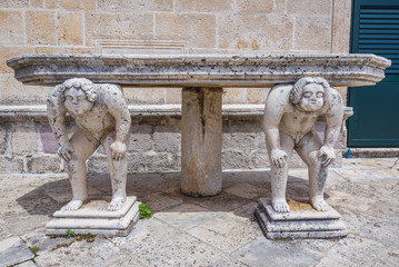 Stone table with sculptures on the isle of Our Lady of Rocks in Kotor Bay, Montenegro