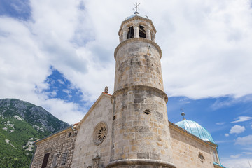 Obraz premium Close up of church belfry on the small islet of Our Lady of Rocks in Montenegro