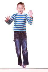 Little boy jump have fun alone at home..