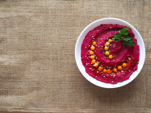 Hummus with beets. Middle Eastern food.
