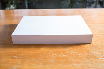 White paper on wood table