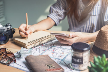 Young women traveler planning vacation trip