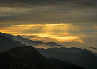 Clouds and sunrays in the mountains of Alishan in Taiwan.