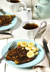 Crepes with banana and chocolate sauce