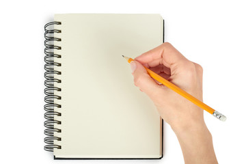 Open black notebook for writing or drawing on spiral in hand, isolated on white background