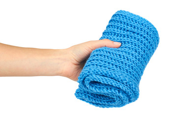 Warm woolen homemade blue scarf in hand, isolated on white background
